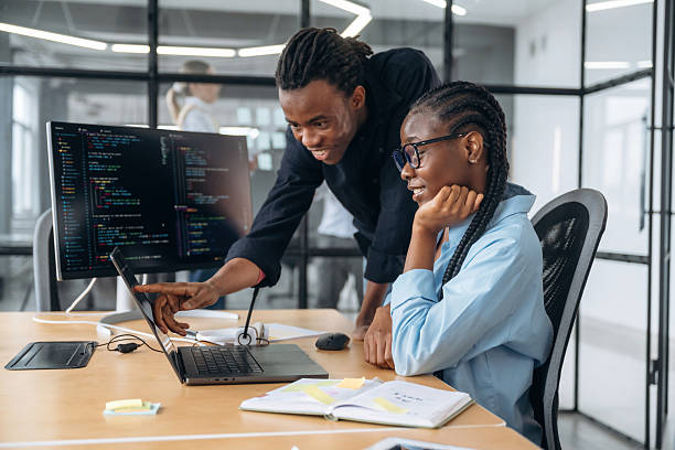 Side view, sitting. Business people are working in the office.